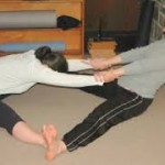 Pair work in forward bend